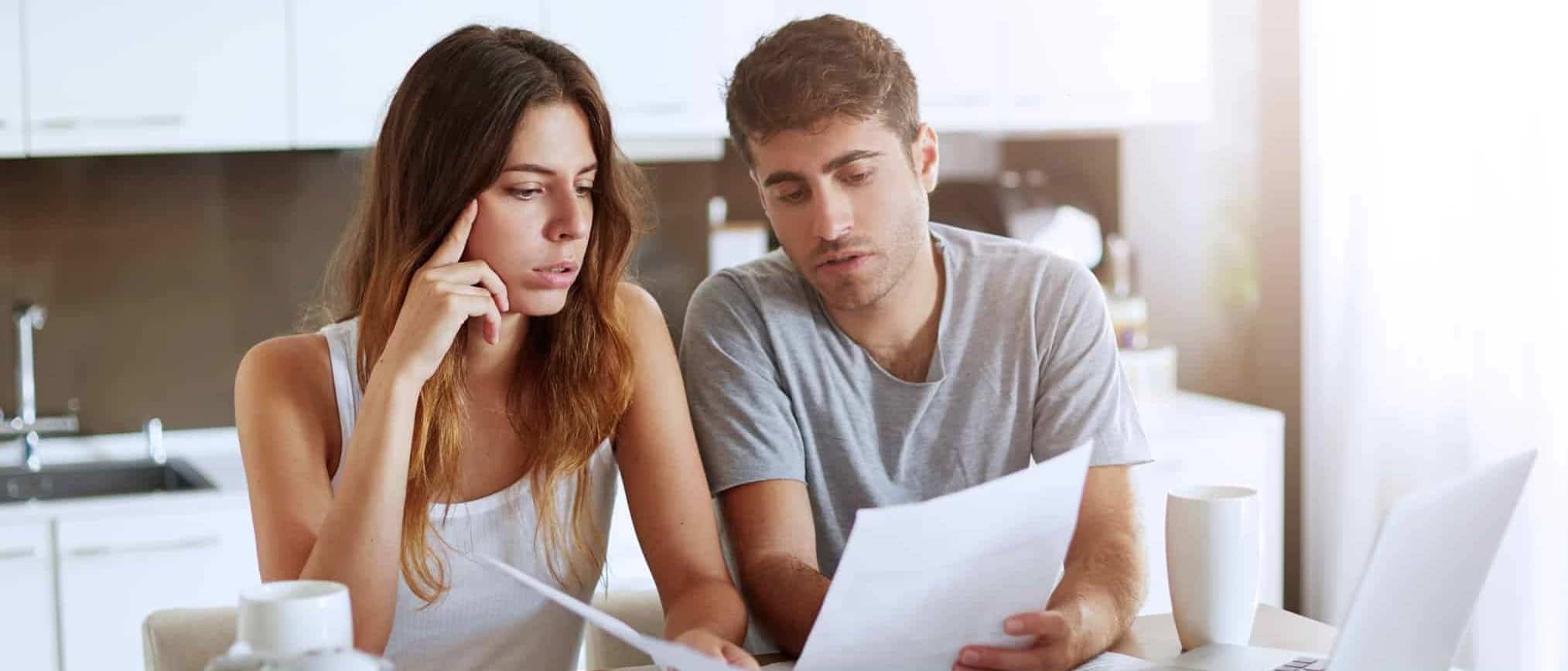 Doctor Finance_couple viewing houses on laptop